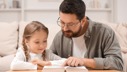 Young child studying scripture with Bible open for memory work, practicing Bible memorization techniques, part of a spiritual growth journey for children